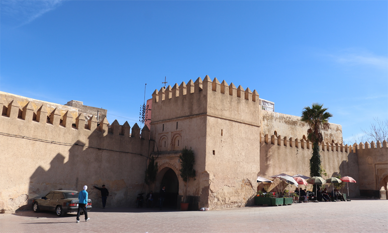 The earthen city walls and arched gateway of the old medina of Sefrou