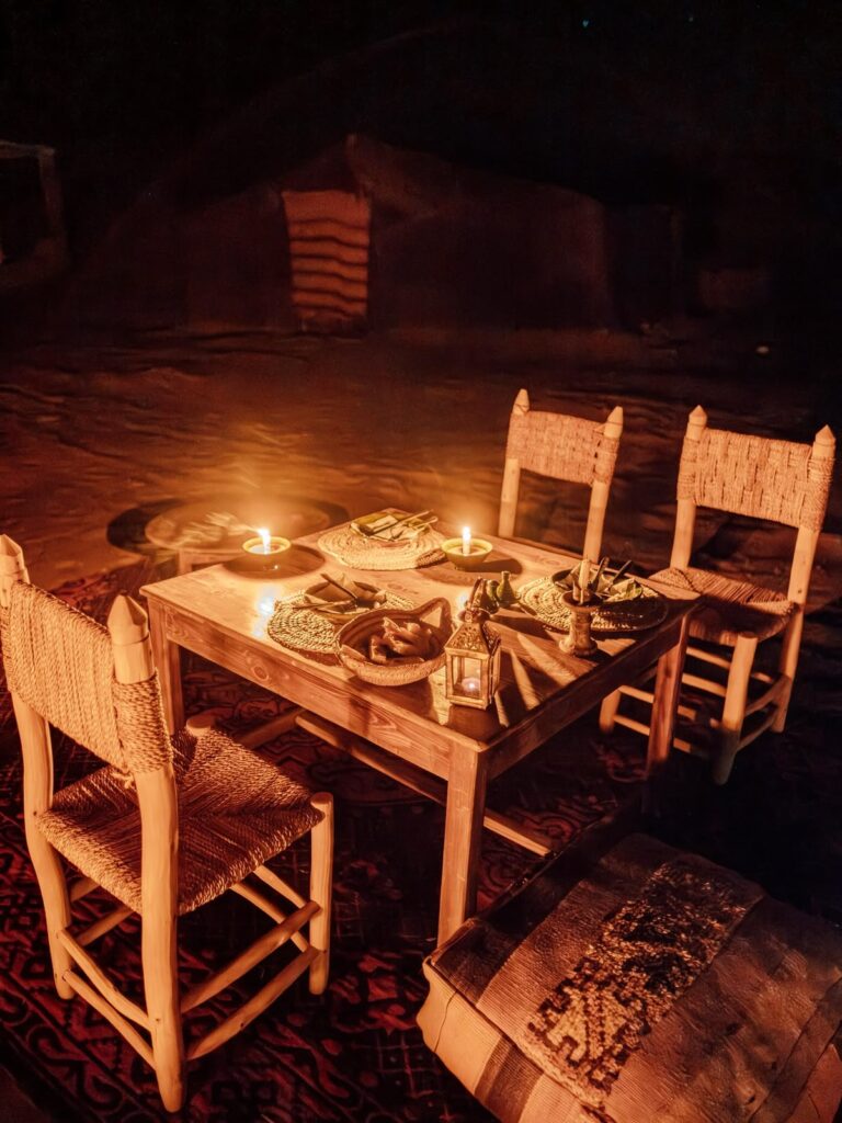 Candlelit dinner under the stars at a remote camp in Erg Chigaga