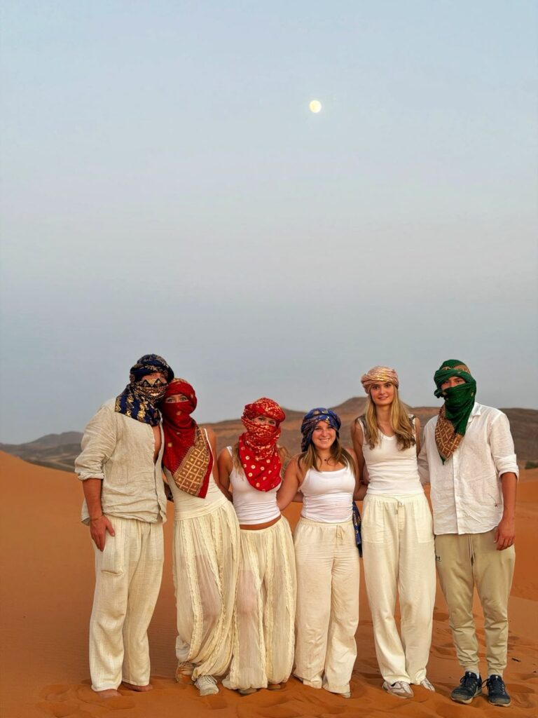 Student group camel trekking in the Sahara Desert, Morocco