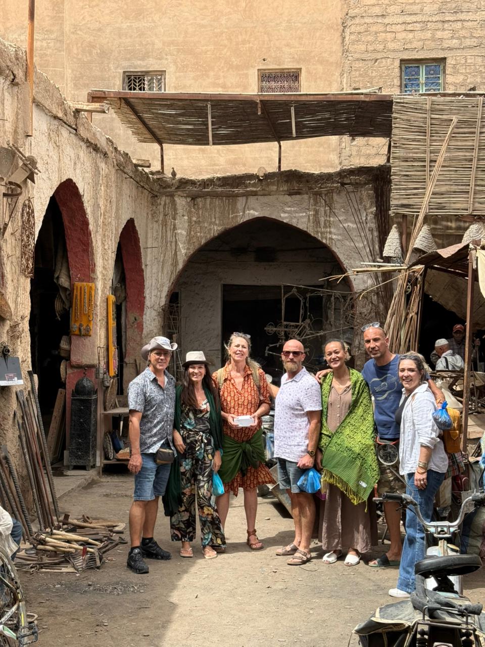 Group of travelers exploring an old kasbah in southern Morocco