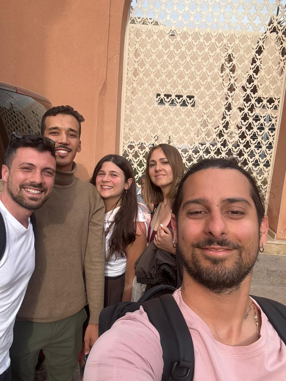 Travelers taking a selfie with their Navigate Morocco guide