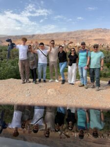 Group of travelers above a palm grove in southern Morocco
