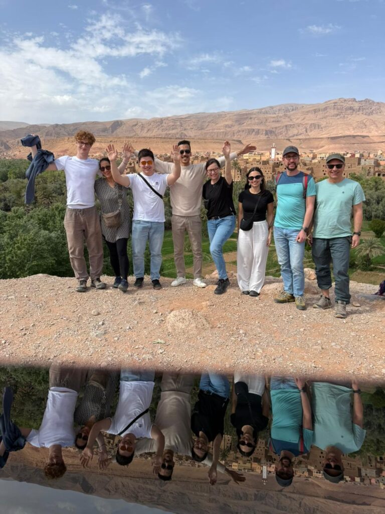Group of travelers above a palm grove in southern Morocco