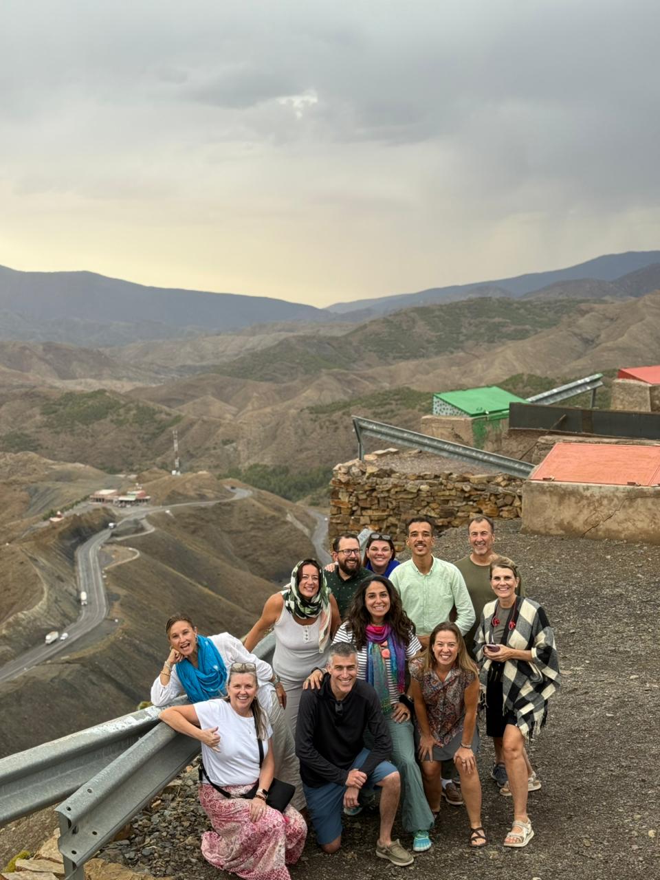 Tour group at a High Atlas mountain pass viewpoint