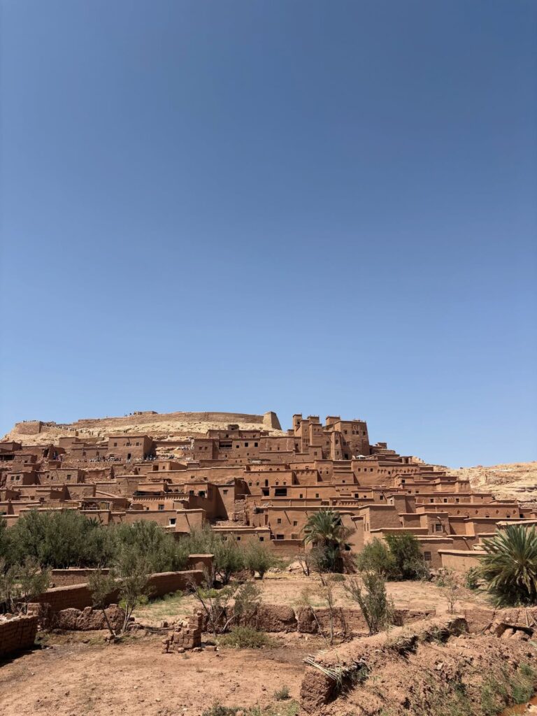 Ait Ben Haddou ksar built of red earth under a blue sky in southern Morocco