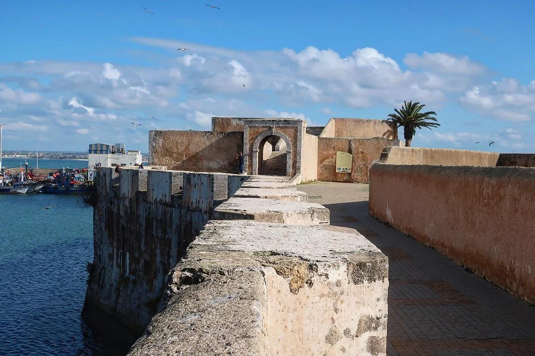 A gateway and walkway on the Portuguese walls of Mazagan beside the harbour of El Jadida