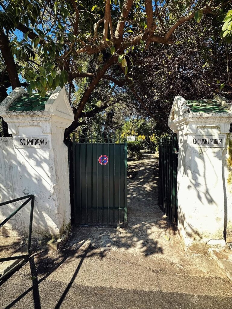 Green gate and white pillars at the entrance of St Andrew's Church in Tangier