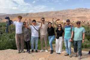 Group of travelers above the Tinghir palm grove near Todra Gorge