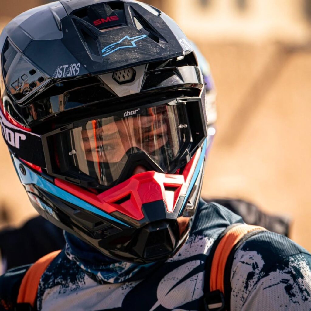 Dirt bike rider in helmet and goggles ready to ride in Merzouga