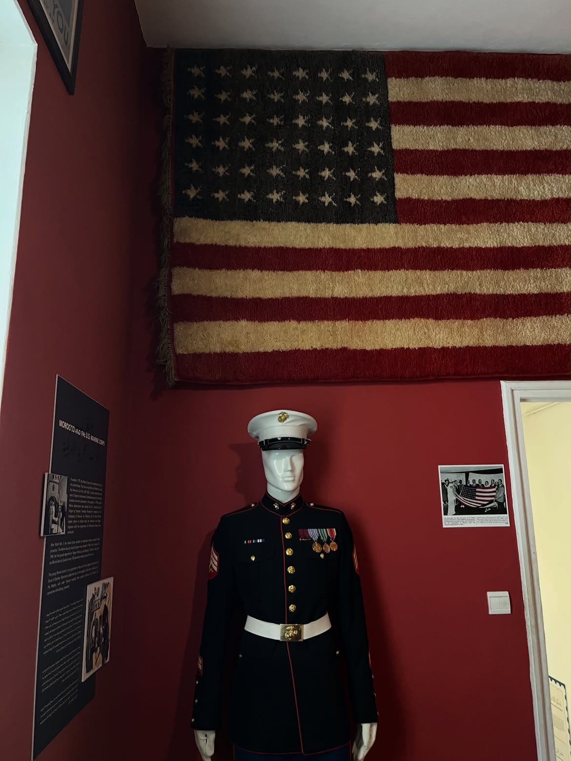 Historic American flag and US Marine dress uniform on display at the Tangier American Legation museum